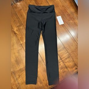 Athleta Elation Shine Tight in Black size Medium. Never worn. New with tags.